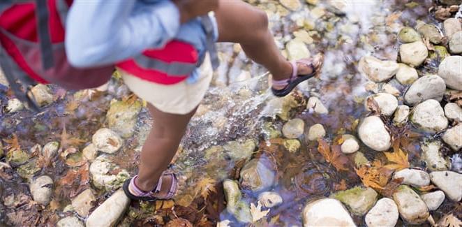 Walking in a stony creek