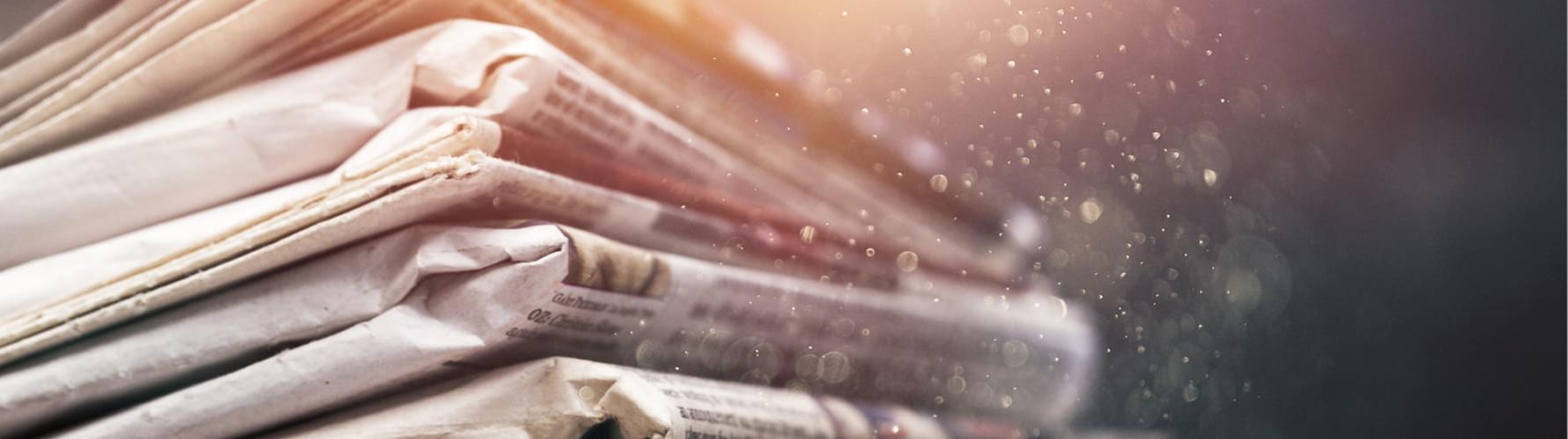 Close up photo of a stack of newspapers